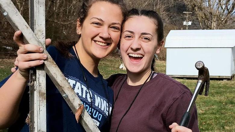 Penn State DuBois students Tayler Rafferty, left, and Hannah Thompson, right, pause for a moment for a picture during their service trip to Kentucky as part of a group from Christian Student Fellowship at Penn State DuBois.